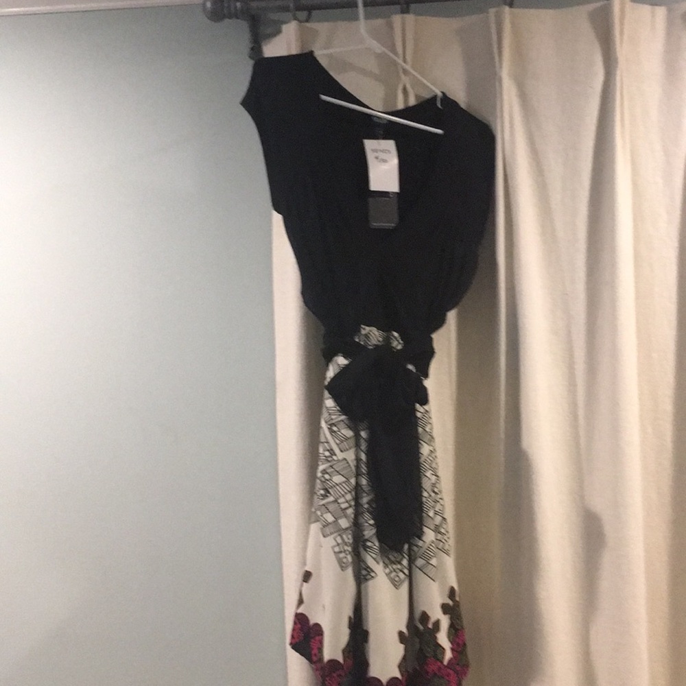 Large. Never worn maternity dress